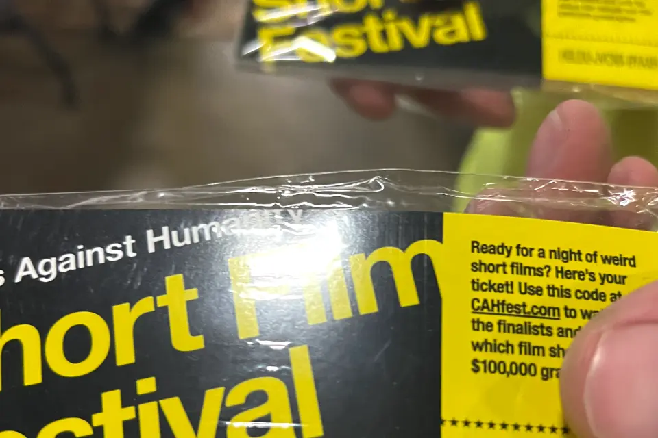 Hand holding a ticket to the short film festival