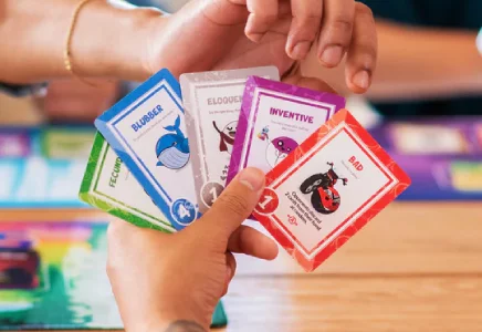 Closeup of players hand of Doomlings cards